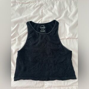 Cropped gray tank top.